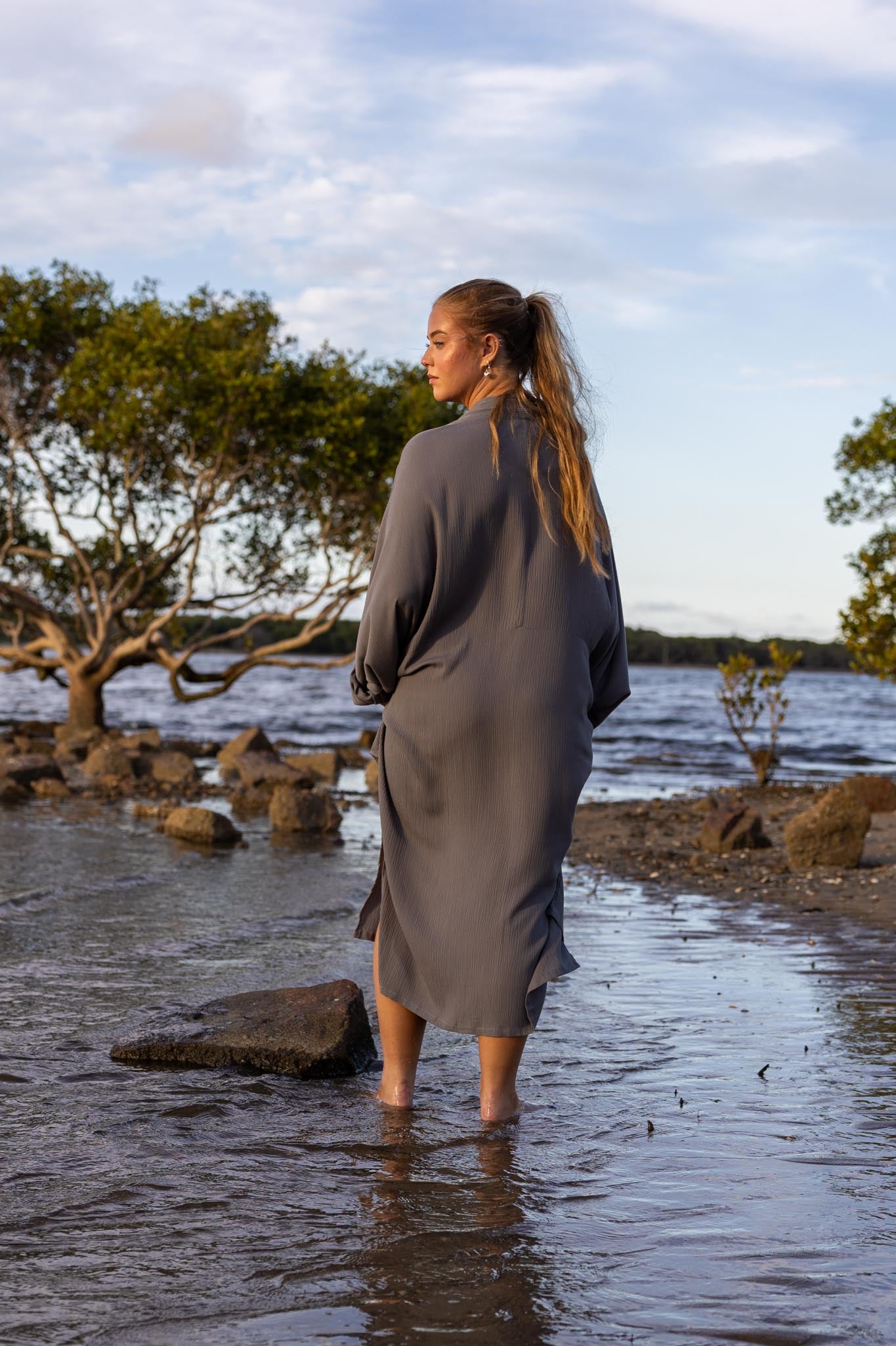Back view of Vacanza dress showing oversized silhouette and loose fit