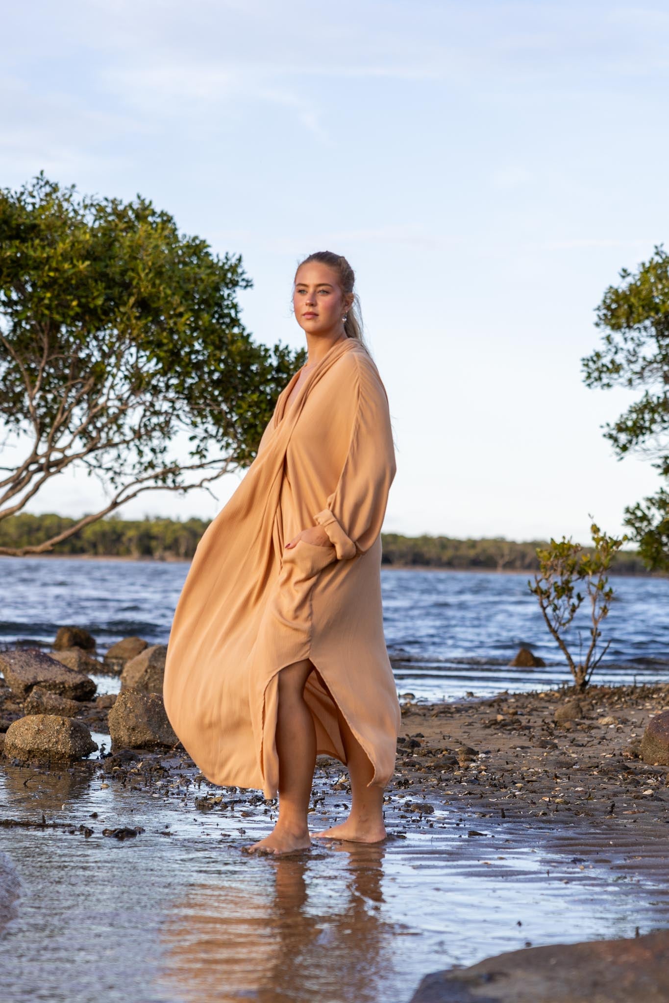 Side angle of Zokkibee Vacanza dress highlighting relaxed, draped style