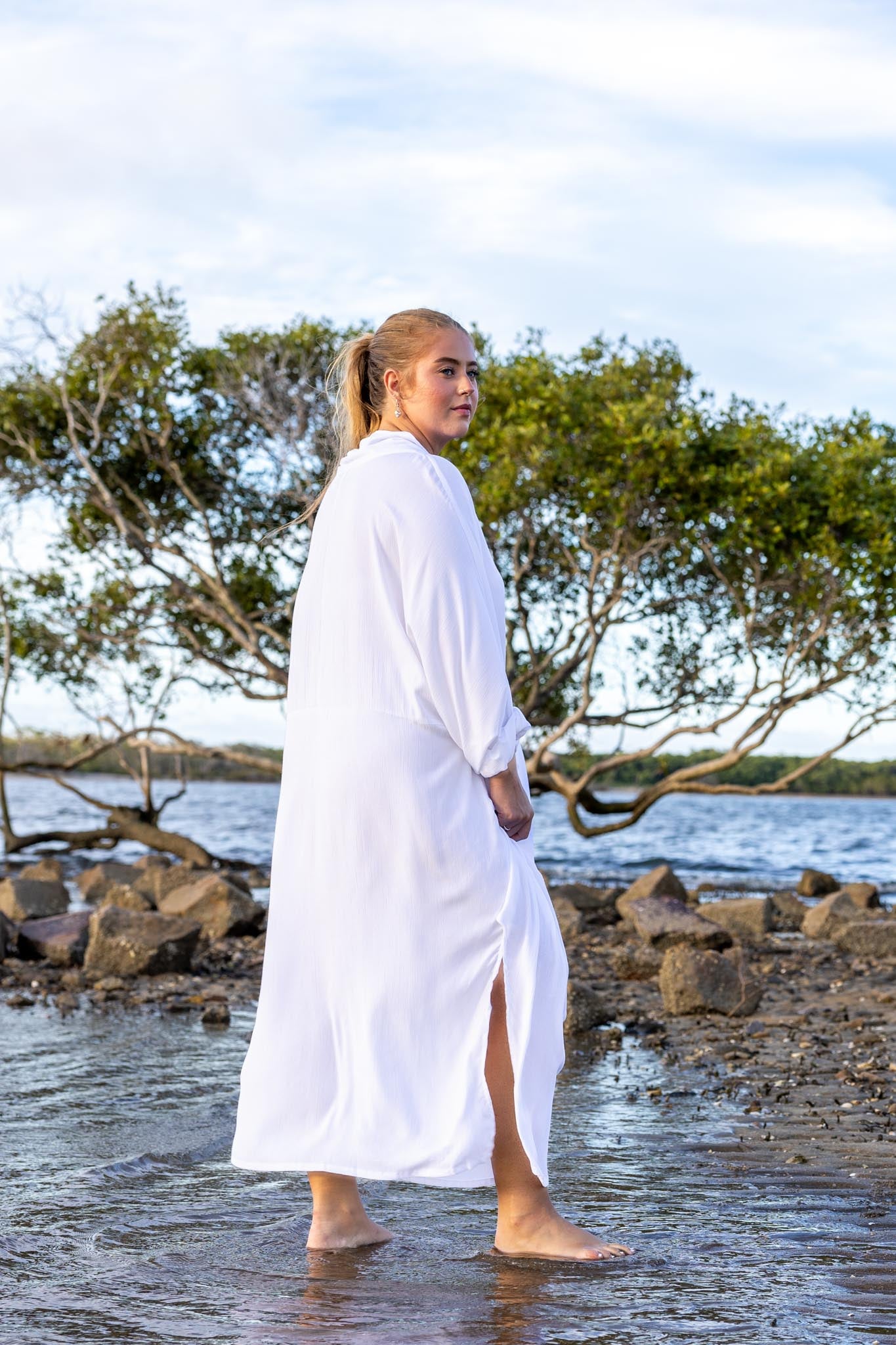 Side angle of Zokkibee Vacanza dress highlighting relaxed, draped style