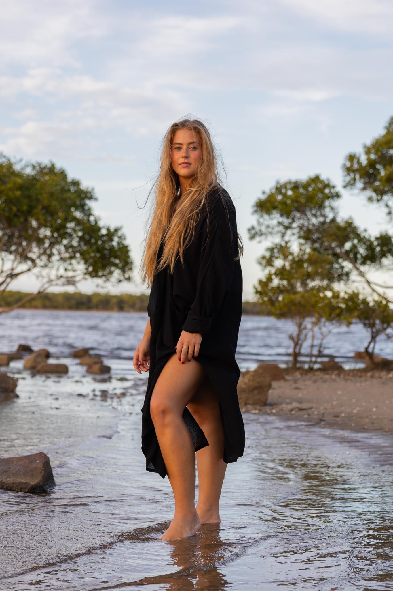 Side angle of Zokkibee Vacanza dress highlighting relaxed, draped style