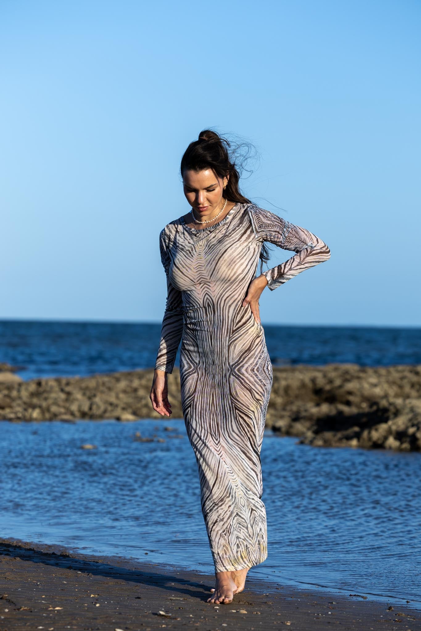 Front view of Zokkibee zebra mesh dress with sheer mesh fabric and bold zebra print